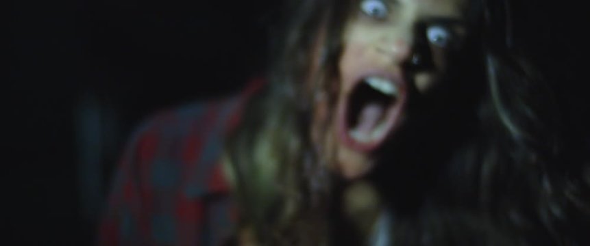 Zombie woman with white eyes screaming, looking scary and terrifying. BMPCC 4K