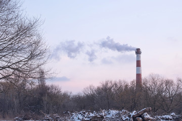 smokestack of a boiler room polluting the environment