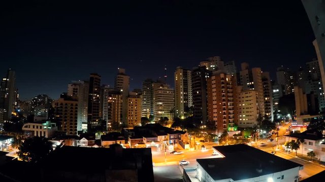 Transition of day to night on a time lapse at the city of Sao Paulo. Buildings of the city at the Aclimacao residential neighborhood, central area of the city.