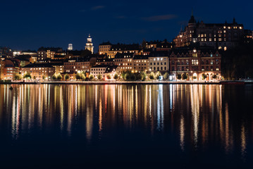 Fototapeta na wymiar View of Sodermalm with illuminated historical buildings during the night in Stockholm, Sweden.