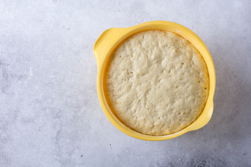 Fresh raw yeast dough homemade for baking pizza, bread or pies.