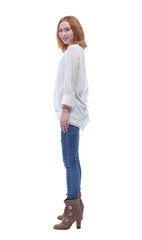 side view. confident fashionable young woman in jeans and high boots