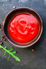 tomato sauce in a gravy boat on the table (sugo or ketchup) menu concept. background. top view. copy space