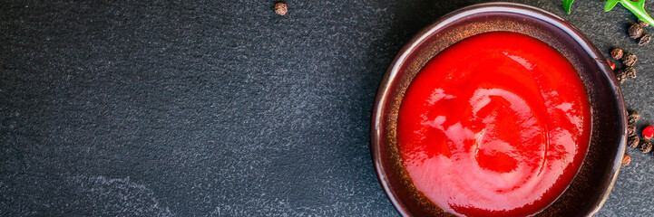 tomato sauce in a gravy boat on the table (sugo or ketchup) menu concept. background. top view. copy space
