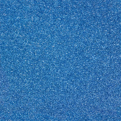 Surface texture with blue sparkles. Seamless festive background. Dark backdrop