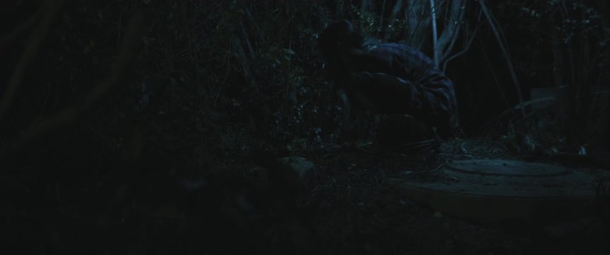 Scary zombie creature woman eating human hand in the woods. BMPCC 4K