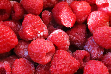 Fresh frozen raspberries. Close-up. Top view. Background. Texture.
