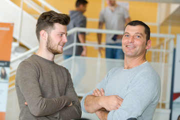 men in an establishment interior posing