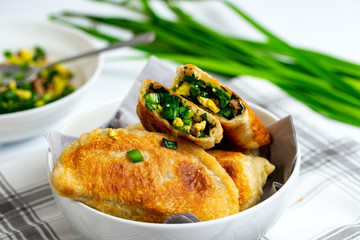 Chinese chives boxes - homemade pan fried chive dumplings in white bowl
