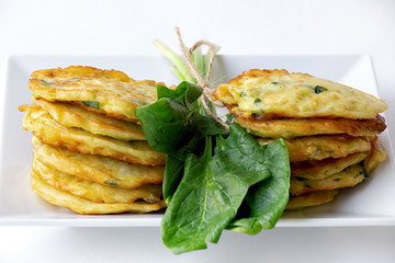 Pancakes made of marrows and spinach with the addition of rickot cheese