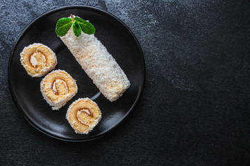 coconut sponge cake roll biscuit (delicious sweet dessert) menu concept. background. top view. copy space