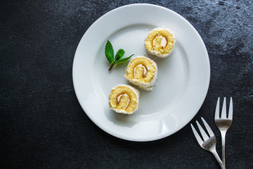 coconut sponge cake roll biscuit (delicious sweet dessert) menu concept. background. top view. copy space