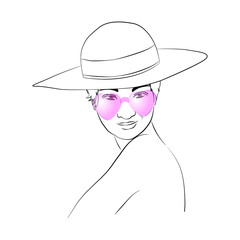 Woman in hat, pink glasses with a studying look.