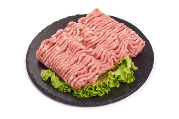 Fresh beef minced meat on a stone plate, isolated on white background