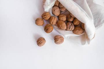 Eco bag with walnut on white background