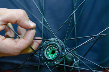 bicycle repair. Replacing the lubrication and cleaning of bicycle hub bearings. In the hands of the...
