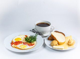 cup of coffee eggs and bread