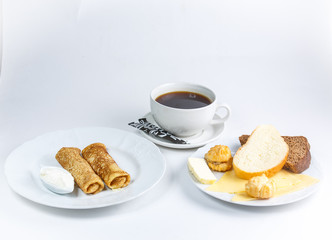 cup of coffee and croissant on a table