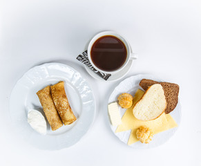 cup of coffee and cake isolated on white background