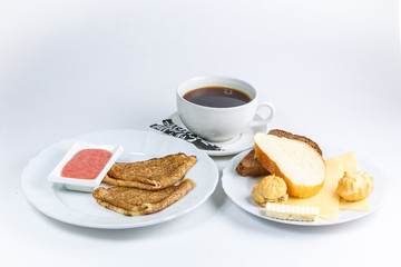 cup of tea and cookies on plate