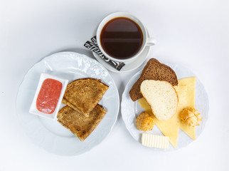 cup of coffee and cake on a plate