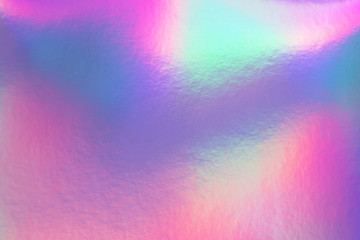 Abstract trendy rainbow holographic background in 80s style. Blurred texture in violet, pink and...