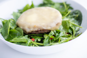 Close up of tasty cheese beef patty