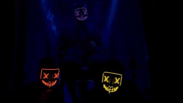 guys in scary glowing masks.