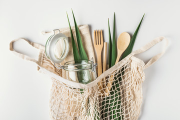 Zero waste, plastic-free and eco-friendly lifestyle. Cotton mesh bag, glass bottle, jar and bamboo...
