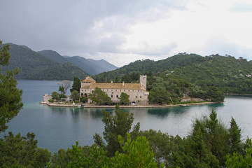 Fototapeta na wymiar an abandoned monastery on an island on the lake