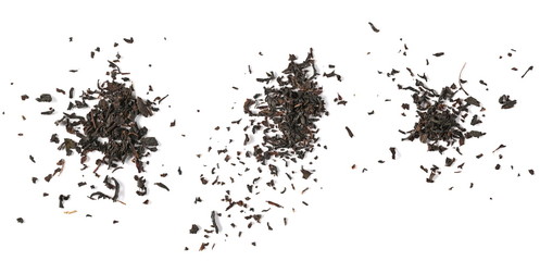 Set dry black tea leaves isolated on white background, top view