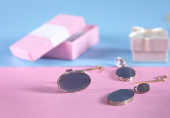 different jewelry on the blue and pink background