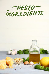 Ingredients for pesto sauce on grey table