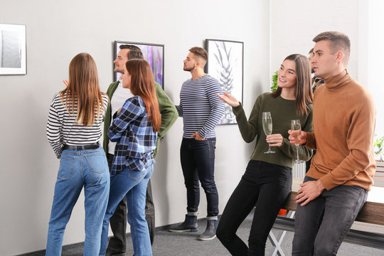 People at exhibition in modern art gallery