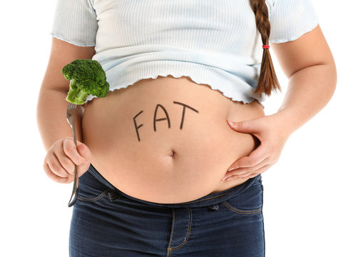 Overweight girl with healthy broccoli on white background