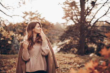 Young woman in autumn park. 