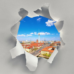 Paper hole with image of aerial view of central Berlin in Spring, including river Spree and...