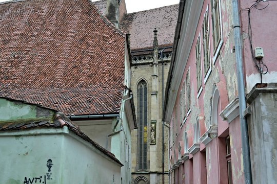 Narrow street in Brashov with view of Biserica Naegra, Romania