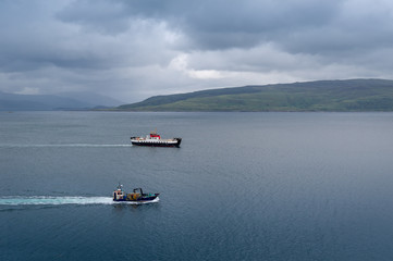 Small ferry and fishing vessel in scottish waters. Tobermory, Hebrides islands, Scotland.