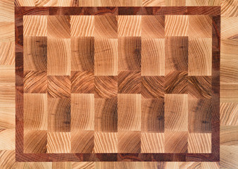 Wooden butcher chopping block, natural end wood board texture background pattern close up