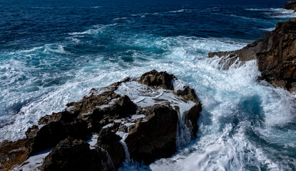 Waves crash on the rocky shore of the Mediterranean Sea on the Akamas Peninsula in the northwest of the island of Cyprus.