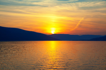 Obraz premium sunset over the and beautiful clouds