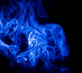 Blue smoke on black background