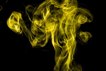 Obraz premium Yellow smoke on black background