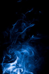 Blue smoke on black background