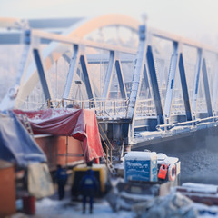 Bridge construction site, over the river in a cold winter day, bridge under construction in progress