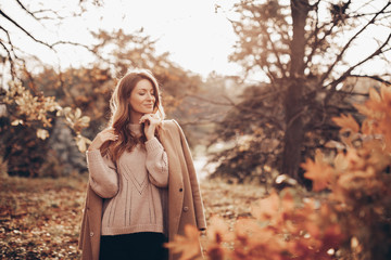 Young woman in autumn park.  