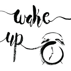 Clock alarm with text 'wake up' painted by ink with brushes isolated on white background. 