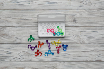 colorful children's educational game on wooden background with copy space for text. challenging...