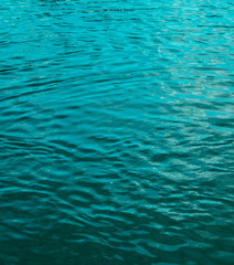 Blue cyan water in pool sea as natural texture summer background